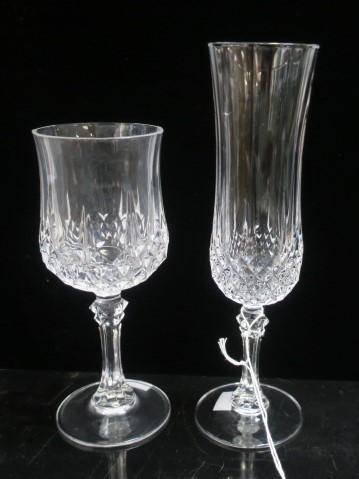 CRISTAL d'ARQUES "Longchamp" Champagnes & Wines: Eight: CRISTAL d'ARQUES "Longchamp" Champagnes & Wines: Eight 8"T Champagne Flutes and Six 6 1/2"T Wine Stems. All in Good Condition. (100-200)
