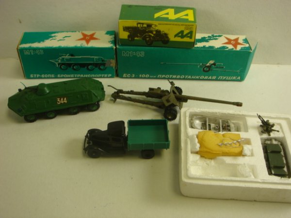 4 Metal Military Models: 4 Metal Military Models 1;43 Scale BTR 60 and 100mm Anti-tank Guns in Boxes. AA Soviet Model of Light Truck. Metal Casing Model un-built of BTR 60 and Towed Dual 23mm Anti-Aircraft Gun Unassembled. (5