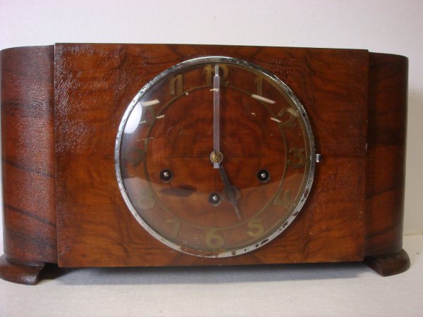 Burled Walnut Vintage Clock:: Burled Walnut Vintage Clock: Works Marked with Crossed Arrows Over 338. Pendulum, No Key, Second Hand Missing. Brass Roman Numerals, Rounded Ends. 16"W X 8"T X 5'D. (50-90)