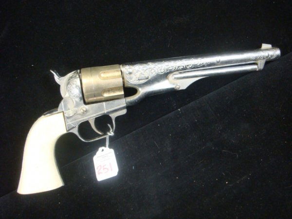 HUBLEY 1950's Toy Colt 45 Cap Pistol: HUBLEY 1950's Toy Colt 45 Cap Pistol: 14"L, Nickel Plated with Plastic Grips. Fold Down Handle Under Barrel Turns It to Release Barrel. Barrel Turns when Trigger is Pulled. (75-150)