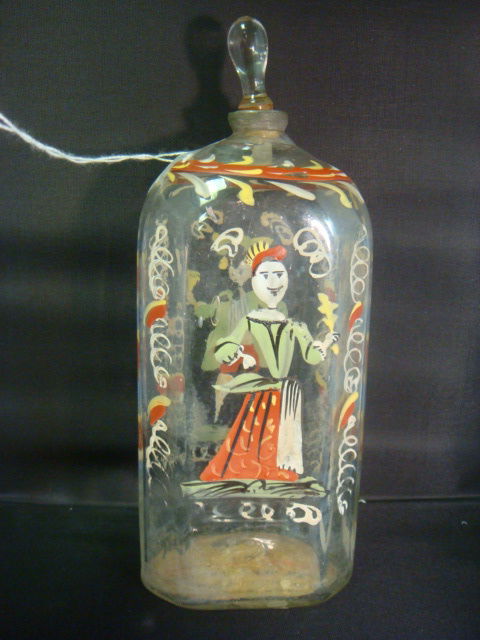 18th C Painted Bottle with Stopper: 18th C Painted Bottle with Stopper: Mold Blown Clear Glass Shouldered Bottle with Hand Painted Enamel Male and Female Figures. Clear Teardrop Stopper. Pewter Collar. Family Message on Bottom, Dating B