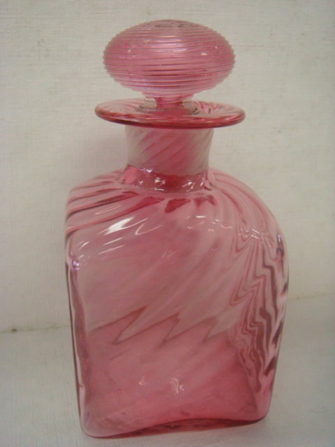 STEUBEN Gold Ruby Cologne Bottle:: STEUBEN Gold Ruby Cologne Bottle: Square Body with Swirled Body and Controlled Threaded Stopper with Frosted Interior. Teardrop Dauber. Form #6887. 5"T. (200-400)