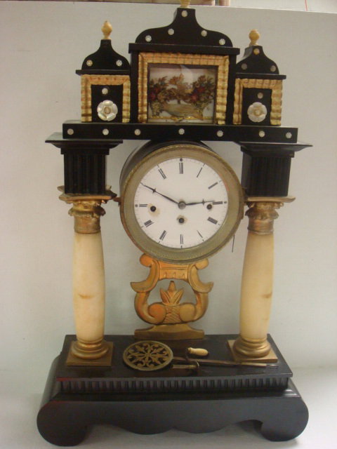 Ebonized Wood and Onyx Westminster Chime Clock:: Ebonized Wood and Onyx Westminster Chime Clock: Mosque Like Super Structure with Onyx Finials, Mother of Pearl Accents and Glass Encased Baskets of Flowers. Supported by Onyx Columns on Ebonized Woode