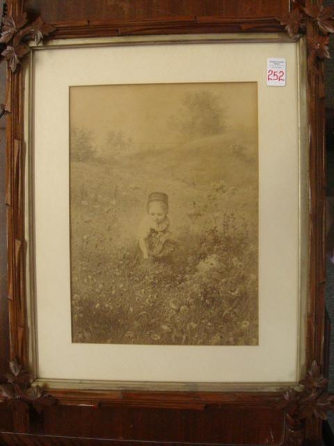 LUDWIG KNAUS Print in Oak Leaf Frame:: LUDWIG KNAUS Print in Oak Leaf Frame: Listed German Genre Painter, 1829-1910. Titled Girl in Field From Original Oil. 1 1/2" Frame with Oak Leaf Corner Swags. Image is 11" X 14" (100-200)