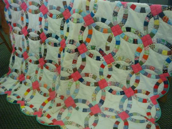 Full Size Hand Stitched Wedding Ring Quilt: Full Size Hand Stitched Wedding Ring Quilt: 86"L with Cream Ground and Country Patchwork Fabric. (60-100)