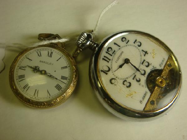 2 Ladies and 1 Man's Pocket Watches:: 2 Ladies and 1 Man's Pocket Watches: Clifford 8 Day, Steel Case, Swiss Made with Partial Works Showing. Bradley, 1 Jewel, Serial # 8810, Case Marked Base Metal 62, Division of Elgin. General Watch Co 