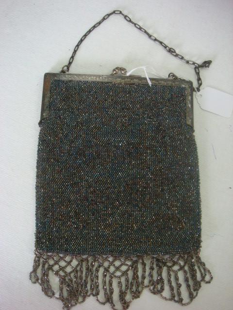 Vintage Beaded Purse with Beaded Fringe: Vintage Beaded Purse with Beaded Fringe: 6 1/2"W X 7"L Purse with 2 1/4"L Fringe has Silver Tone Frame and Chain Handle. Blue Lined Interior. (40-80)