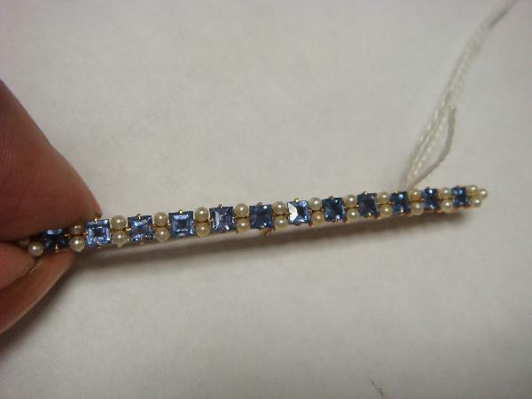 14KT Sapphire and Pearl Bar Pin:: 14KT Sapphire and Pearl Bar Pin: 2 1/2"L with 12 Round Prong Set Sapphires Divided by Small Round Pearls. Has Safety Locking Clasp. (100-200)
