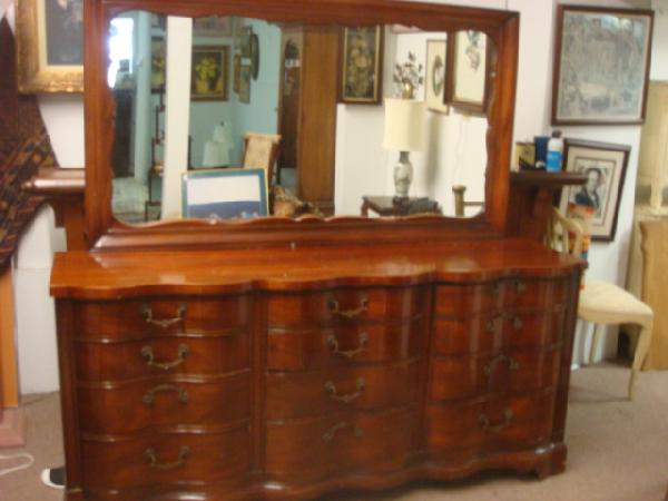 Serpentine Mahogany Dresser with Mirror: Serpentine Mahogany Dresser with Mirror: 6'L with 12 Drawers and Full Length Mirror on Brackets. (200-300)
