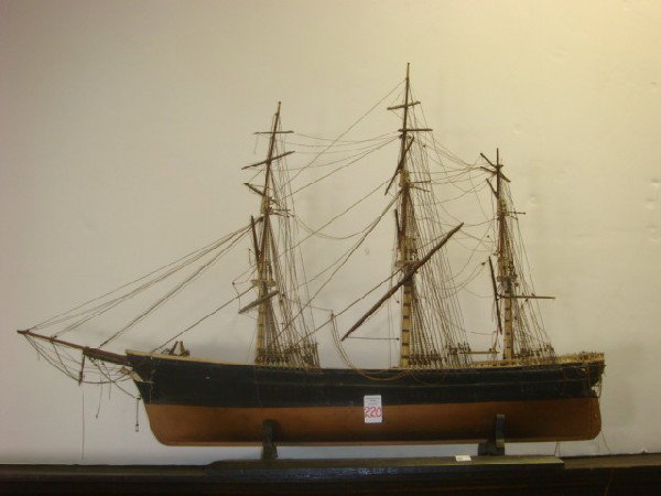 Wooden Rigged Sailing Ship Model on Stand:: Wooden Rigged Sailing Ship Model on Stand: Model of "Flying Cloud" the Greatest American Clipper Designed by Donald McKay. Hand Built and Fully Rigged. Fair Cond. 36'L, 26"T. (100-300)