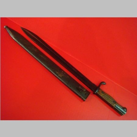 MAUSER Bayonet 14 1/2" Blade:: MAUSER Bayonet 14 1/2" Blade: Metal Self Sharpening Scabbard Marked "I/J.R. 1526", Manufactured by Fichtel & Sachs Schweinfurt, SN 6810. Wooden Handle and Working Release, Very Good Condition. (100-12