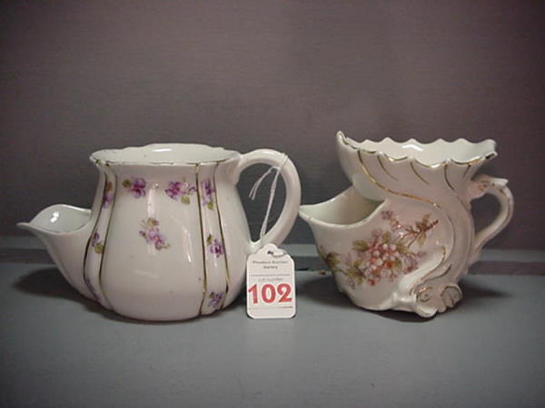 2 Victorian China Scuttle Shaving Mugs: 2 Victorian China Scuttle Shaving Mugs: 3 3/4"T. Fish Design Mug has Pink Floral Transfers and Gold Accents. Has Number 3313 on Bottom. 3 1/2"T. Mug has Violet Transfers and Gold Accents. Both show We