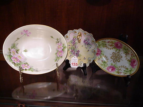 3 Victorian Porcelain Floral Motif Pieces: 3 Victorian Porcelain Floral Motif Pieces: 6 1/4"D. Tidbit Finger Dish has Hand Painted Violets, Gilt Accents. Marked Austria. 7 1/2"L. Oval Limoges Coronet Dish has Hand Painted Florals, Gold Accents