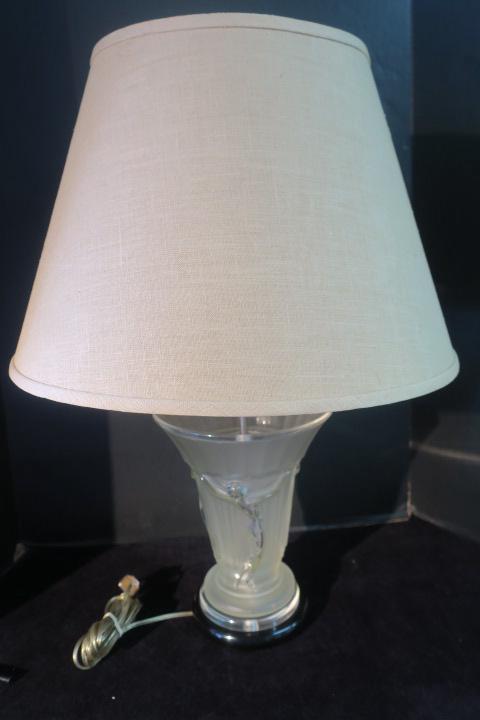 Lalique Style Vase Converted to Lamp:: Lalique Style Vase Converted to Lamp: Frosted Glass Vase with 3 Nude Dancers on Sides and Flared Panel Top. Lucite Top with Pole at Center. Clear & Black Base. Single Light. Cloth Shade. 26"T Overall.