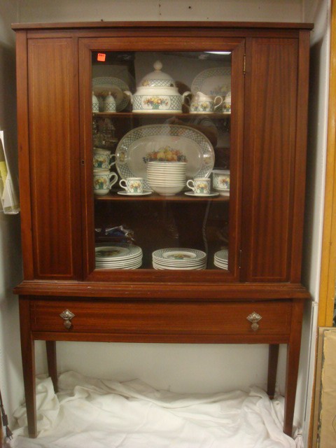 Hepplewhite Style Inlaid Mahogany China Cabinet: Hepplewhite Style Inlaid Mahogany China Cabinet 42" X 17" X 62"T. Has Single Glass Door Flanked by Flame Side Panels, All with Band Inlay. Has Lower Drawer with Square Tapered Legs. Ca. 1920 (300-450)