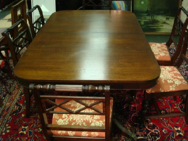 Double Pedestal Mahogany Dining Table with 6 Chair: Double Pedestal Mahogany Dining Table with 6 Chairs: Duncan Phyfe Styling with Line Carved Splay Legs and brass Capped Animal Feet. 67"L with 2 After Market White 16"W Extension Boards. 1 Arm & 5 Side