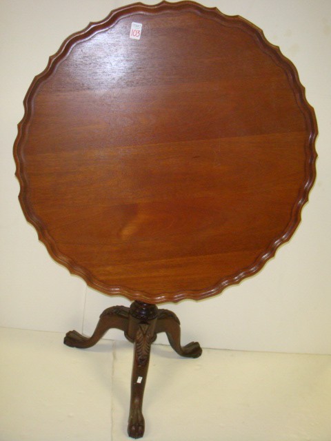 Mahogany Tilt Top Round Pie Crust Table, Carved Ba: Mahogany Tilt Top Round Pie Crust Table, Carved Base: Irregular Scalloped Pie Crust Edge with Baluster Spindle Cage on Turned Pedestal Over Acanthus Carved Legs and Ball & Claw Feet. 32"D Top, 28"T (3