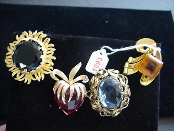 4 Single Stone Designer Brooches: Inclu: 4 Single Stone Designer Brooches: Includes 2 1/2" Boucher Apple, Capri 2 1/4" Starflower, 2 1/2" Coro Craft Sterling Bow and Robert Blue Stone Brooch/Pendent.