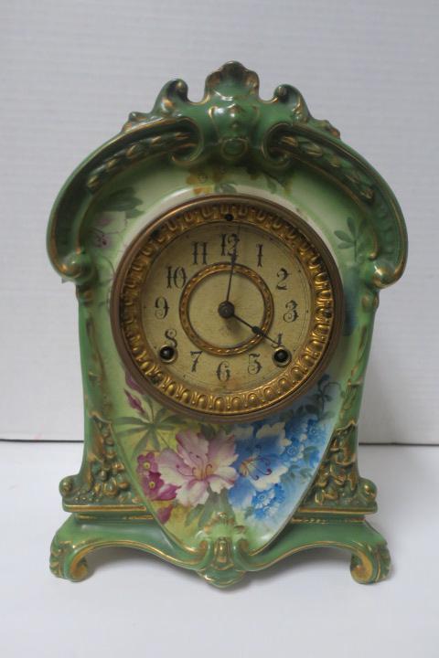 ANSONIA Clock in Hand Painted ROYAL BONN Porcelain Case: ANSONIA Clock in Hand Painted ROYAL BONN Porcelain Case ROYAL BONN Germany Porcelain LA CRUZ Case Green Ground with Blue, Purple and Yellow Florals & Gilt Accents. Ansonia Clock Co. Missing Pendulum a