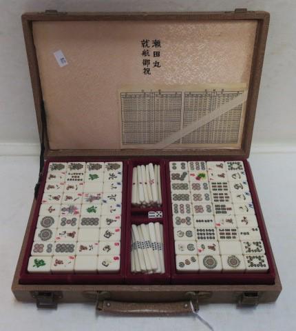 Vintage Chinese Mahjongg Set in Case:: Vintage Chinese Mahjongg Set in Case: Travel Set has 144 Tiles Measuring 1" X 3/4". Tiles with Bamboo Backs. Faux Alligator Case with Satin Lining in Lid. Some Wear to Tiles and Case. (80-160)