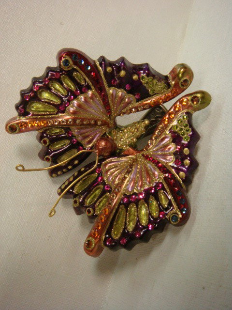 Signed JAY STRONGWATER Butterfly Ornament:: Signed JAY STRONGWATER Butterfly Ornament: From Neiman Marcus in Original Box. Purples with Lime Green. Butterfly Clip on Spring. Accented with Swarovski Crystals. 4" X 3 1/2". (100-200)