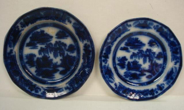 2 Flow Blue Plates: 2 Flow Blue Plates: Ironstone Plates in Manilla Pattern are 8" and 8 3/4"D. Age Crazing and Staining. (100-120)