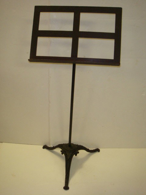 World's Peace Jubilee 1872 Wrought Iron Music Stan: World's Peace Jubilee 1872 Wrought Iron Music Stand: 46"T Stand from 1892 Boston, Mass. Jubilee. Has Wooden Sheet Music Holder and Cast Iron Base with World Peace Logo. (100-150)