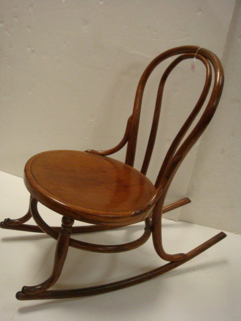 Oak Bentwood Rocking Chair:: 1920's Oak Bentwood Rocking Chair: Pressed Pattern Round Seat with Ring Stretcher. Double Hoop Back. (30-40)