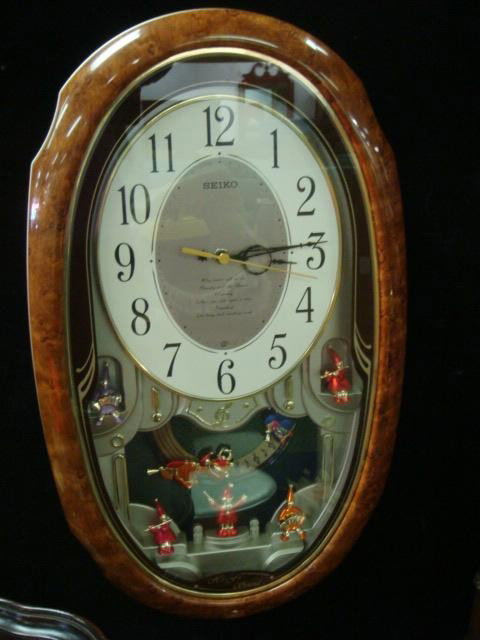 SEIKO Musical Clock:: SEIKO Musical Clown Band Clock: Clock Plays 6 Different Tunes. Hi-Fi Sound. Faux Wood Grain Frame. (100-200)