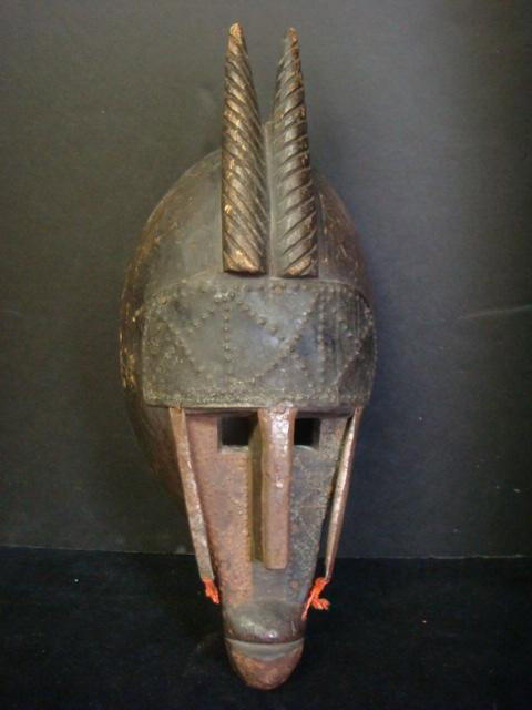 Hand Carved Niarka Tribe Mali Mask:: Hand Carved Niarka Tribe Mali Mask: Horned Mask Accented in Hammered Metal, Elongated Nose, Square Eyeholes. (120-250)