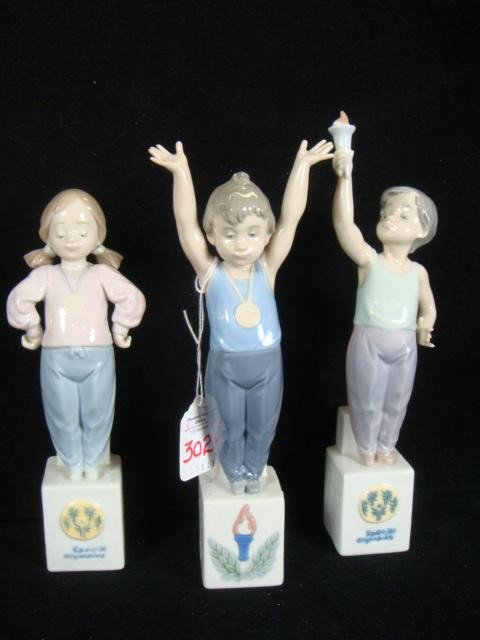 LLADRO Olympic Pride, 5871 Olympic Champion, 7513:: LLADRO Special Olympic Children, 5871, 7513, 7515: 5871, 1992-1996, 9 1/2"T, Antonio Ramos. 7513, 1992- 96, 10"T. 7515, 8 1/2", Antonio Ramos, 1992-1996. Mint in Box. (140-260)