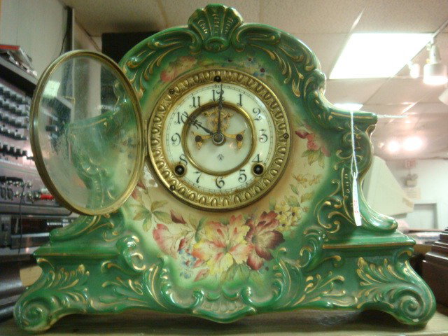 ANSONIA CLOCK CO Porcelain Shelf Clock:: ANSONIA CLOCK CO Porcelain Shelf Clock: Works Marked Patent June 14.81. Second Patent Date June 1882. Case Marked PECONIC. (200-300)