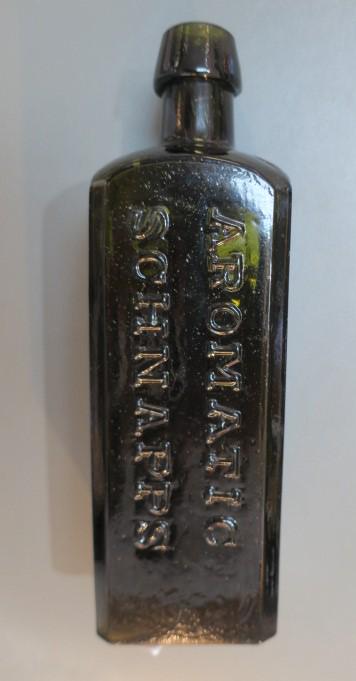 UDOPHO WOLFE'S Aromatic Schnapps Bottle: (1 of 3)