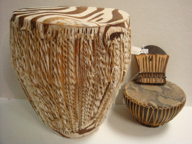 2 African Drums and Kalimba Musical Instrument:: 2 African Drums and Kalimba Musical Instrument: 14"T with Zebra Skin Head and Braided Hide Sides. Wooden Body Drum with Snakeskin Head is 5"T. 9 Key Kalimba From South Africa is 5" Wide. (80-100)