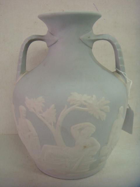 Portland Vase Reproduced by Buffalo Pottery: Portland Vase Reproduced by Buffalo Pottery: Limited Edition, Marked In The Art Lamelle for S.R. Sperans. Piece No. 23. Classical Figures on Pale Matte Blue Ground.8 1/4"T (400-600)