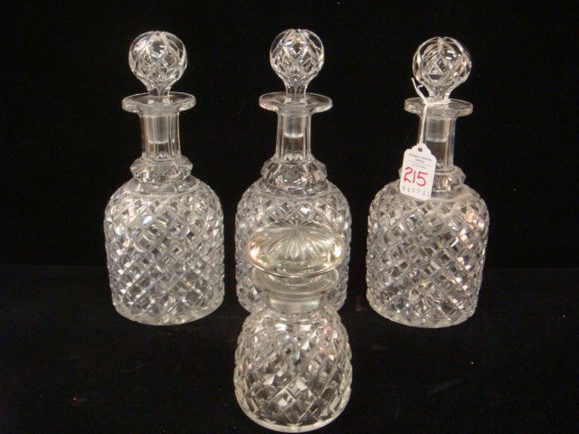 Three Crystal Block Pattern Decanters & Bottle: Three Crystal Block Pattern Decanters & Bottle: Decanters Have Polished Star Cut Bottoms, 9 1/2"T at Stopper. Paneled Neck with Uncut Lip. Individual Bottle has Polished Bottom, Squat Stopper and is 5