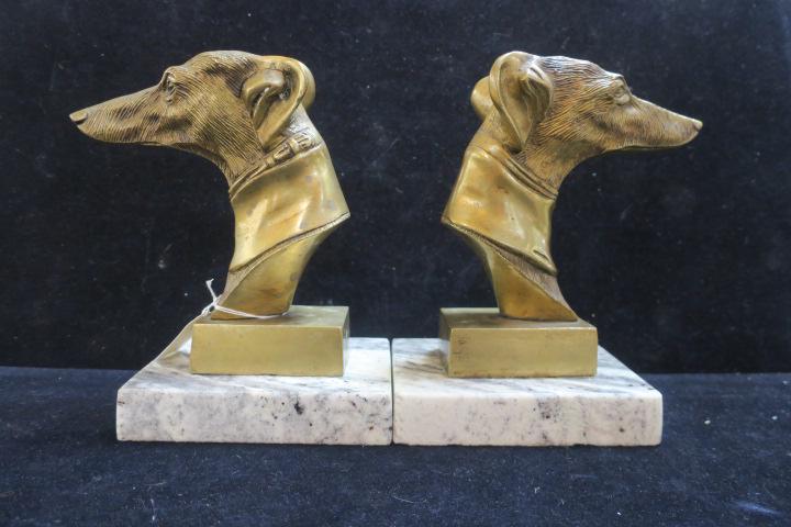 Pair of Art Deco Style Whippet Sculpture Bookends:: Pair of Art Deco Style Whippet Sculpture Bookends: Cast Iron Whippet Busts with Bronzed Finish are 9"T and Mounted on Marble Bases. (200-400)