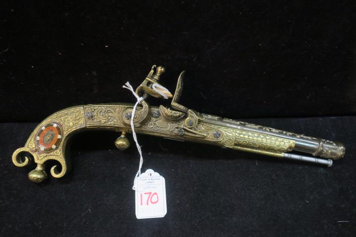 Replica Thomas Caddell Scottish Flintlock Pistol:: Replica Thomas Caddell Scottish Flintlock Pistol: Replica of Pistol Said to have Fired the "Shot Heard Round the World" at Lexington Green in 1775. 12" Pistol with Ornate Pommel, Ball Trigger and Belt