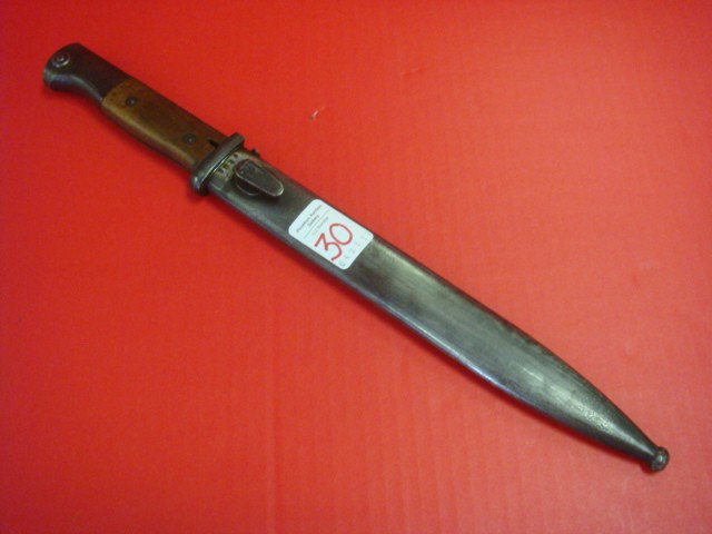 MAUSER 10" Bayonet with Self Sharpening Scabbard:: MAUSER 10" Bayonet with Self Sharpening Scabbard: Wooden Handles with 10" Blade marked JWH and 5540 on Reverse, Metal Self Sharpening Scabbard Marked jwh 44 and 5540 on Reverse. Very good Condition. (