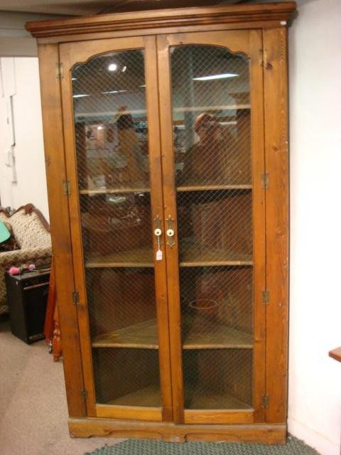 Five Shelf 2 Door Glass Front Corner Cabinet:: Hand Made Pine 4 Shelf Corner Cabinet: Molded Cornice over Double Glazed Doors backed by Diamond Pattern Wire. Brass Exterior Hinges. Ample Shelves with Plate Grooves. (300-500)
