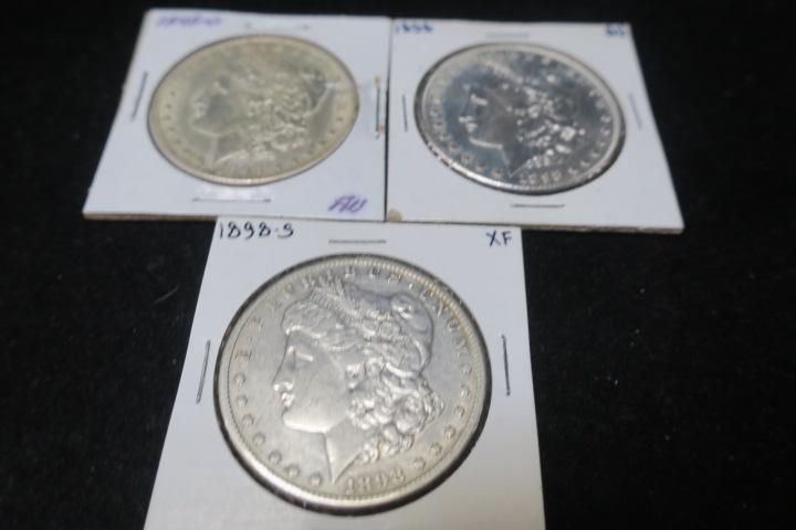 Three 1898 MORGAN SILVER DOLLARS, .90% Pure Silver:: Three 1898 MORGAN SILVER DOLLARS, .90% Pure Silver: 1898 and 1898 O Morgan Silver Dollars in MS 63 Condition with Very Good Luster. 1898 S in VF 40 Condition. (240-400)