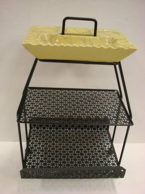 1950's Ceramic Ashtray Cup Holder on Metal Stand: 1950's Ceramic Ashtray Cup Holder on Metal Stand Open Weave Mesh Two Tiered Stand, Ball Feet with Magazine Holder on Bottom Tier. Handle at Top. 21"T. (40-60)