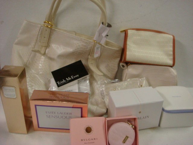 New Estee Lauder Simulated Snakeskin Tote Bag wit: New Estee Lauder Simulated Snakeskin Tote Bag with Makeup, Perfumed Powder, and Laura Mercier Body Cream, Bvlgari Perfume, McEvoy Powders, Guerlain Lotions, Vera Wang Lotions and Samples. (100-200)