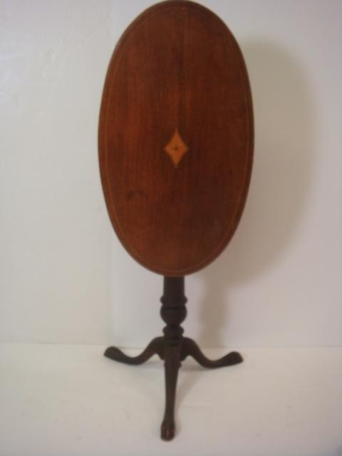 Inlaid Marquetry Oval Tilt Top Side Table:: Inlaid Marquetry Oval Tilt Top Side Table: Inlaid Lined Edge and Diamond in Center of 26" X 14" Top. Turned Stem on Darker Wood with 3 Way Splayed Feet. 28"T. (60-120)