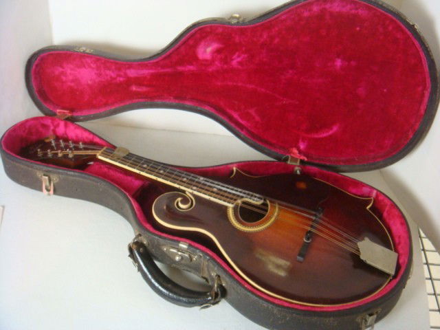 GIBSON, Style F2, CA 1927 Mandolin with Case: GIBSON, Style F2, CA 1927 Mandolin with Case: American Mandolin, Gibson Mandolin-Guitar Company, Kalamazoo, CA 1927. Labeled "GIBSON MANDOLIN STYLE F2 NUMBER 84949 GUARANTEED..." 26" LOA, With Origina
