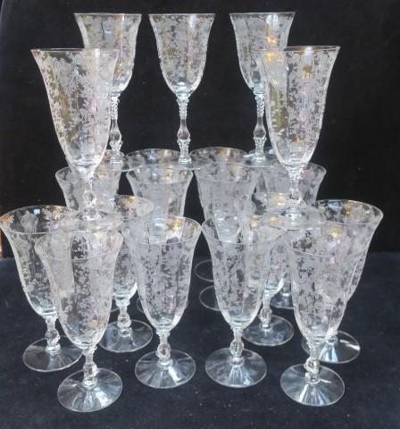 CAMBRIDGE Rose Point Etched Stems, 21 Pieces:: CAMBRIDGE Rose Point Etched Stems, 21 Pieces: CA 1934-1958. Includes Eleven 8 1/4"T Water Goblets and Ten 7 5/8"T Iced Teas. One with rim Chip, one with Foot Chip. (200-400)