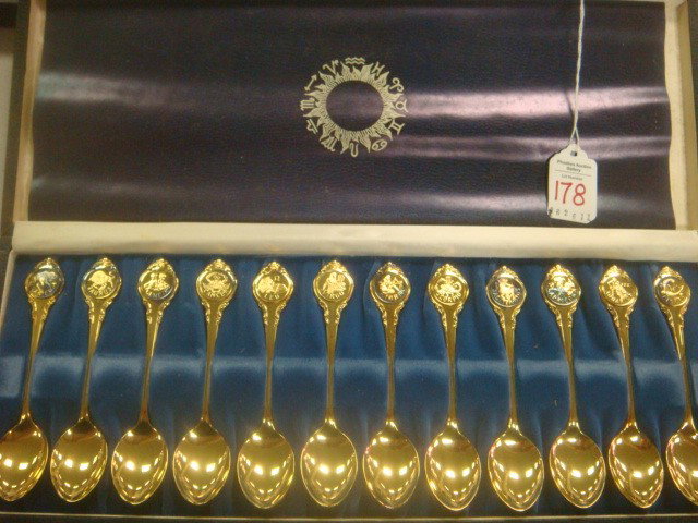 Gold on Sterling Signature Edition Zodiac Spoons:: Gold on Sterling Signature Edition Zodiac Spoons: Franklin Mint Spoons With Artist Signatures on Reverse. 24 KT Gold on Sterling Spoons of the 12 Signs of the Zodiac. In Satin and Velvet Lined Case. E