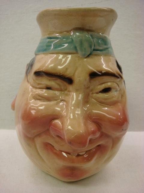 SARREGUEMINES German Majolica Face Jug:: SARREGUEMINES German Majolica Face Jug: Made When France was Occupied by Germany. Black Stamped Mark Used Between 1894-1918. Impressed Sarreguemines and 3181. 8 1/2"T. Crazing. (200-300)