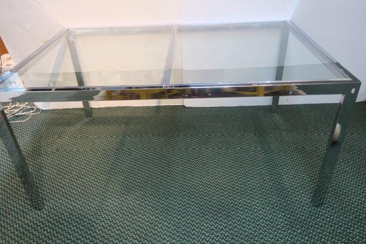 Chrome and Glass Rectangular Parsons Dining Table:: Chrome and Glass Rectangular Parsons Dining Table: 38" X 60" Top, 28"T. Iconic Modern Design in the Style of Milo Baughman. Chrome Frame Floats a Clear Glass Top. Some Surface Scratches. (200-400)