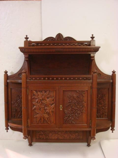 Heavily Carved Walnut Hanging Wall Cabinet:: Heavily Carved Walnut Hanging Wall Cabinet: Super Structure with Spindle Galleried Shelf over Double Door Cabinet. Doors Panels Carved with Flowers and Foliage. Floral Carving Repeated on Side and Apr